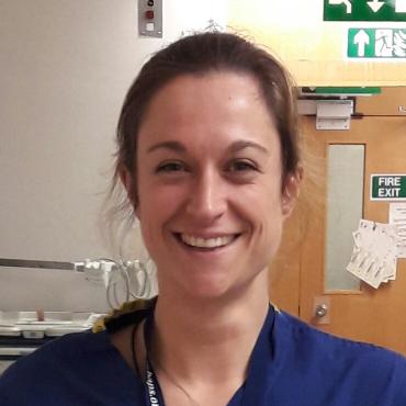 Anna Radford in scrubs in a hospital environment